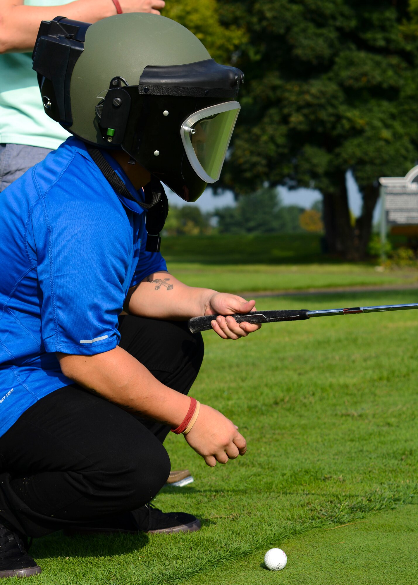 U.S. Air Force Staff Sgt. Paul Rosales, 31st Security Forces Squadron combat arms instructor, lines up a putt during the annual Adam K. Ginett EOD Warrior Foundation Golf Tournament and Auction, Aug. 28, 2015, at Aviano Air Base, Italy. The more than $12,000 from the tournament, auction and raffles went to the EOD Warrior Foundation. (U.S. Air Force photo by Senior Airman Austin Harvill/Released)