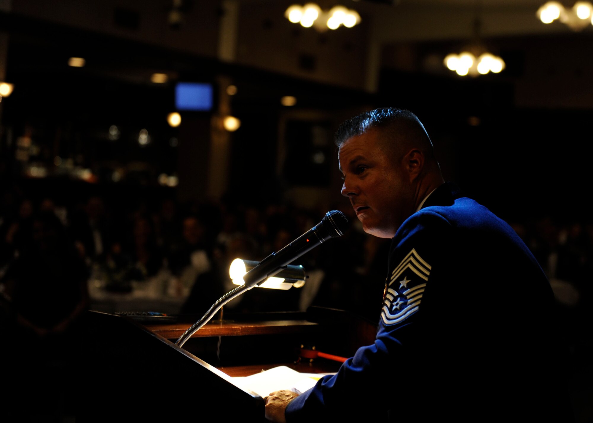U.S. Air Force Chief Master Sgt. Charles Hoffman, 18th Wing command chief master sergeant, speaks to inductees at the Senior NCO induction ceremony Aug. 28, 2015, on Kadena Air Base, Japan. Hoffman was the guest speaker and spoke to the inductees about how proud he was of them and what he expects from them as leaders. (U.S. Air Force photo by Airman 1st Class Lynette M. Rolen)