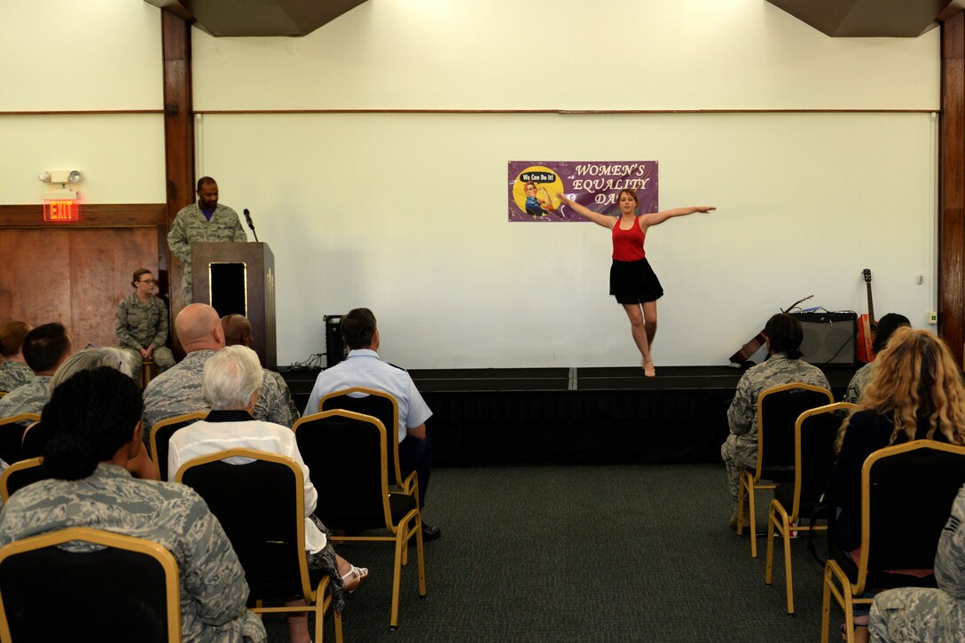 Airman 1st Class Mattison Krouse, 36th Munitions Squadron, performs an interpretive dance during the Women’s Equality Day social Aug. 28, 2015, at Andersen Air Force Base, Guam. This year’s Women’s Equality Day marked the 95th anniversary of the 19th Amendment, which gave women the right to vote in 1920. (U.S. Air Force photo by Airman 1st Class Alexa Ann Henderson/Released)