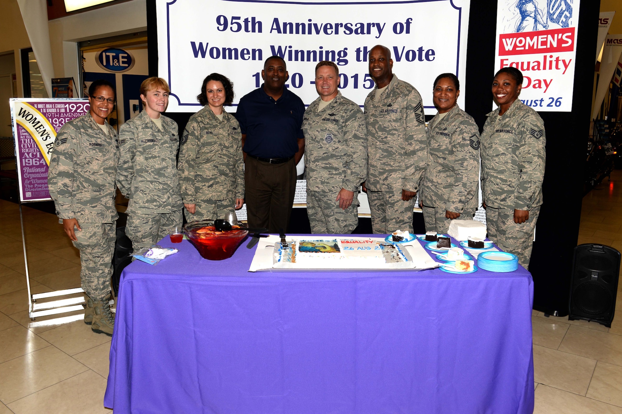 The Andersen Women’s Equality Day committee and 36th Wing leaders stand in front of the Women’s Equality Day booth Aug. 26, 2015, at Andersen Air Force Base, Guam. This year’s Women’s Equality Day marked the 95th anniversary of the 19th Amendment, which gave women the right to vote in 1920. (U.S. Air Force photo by Airman 1st Class Alexa Ann Henderson/Released)