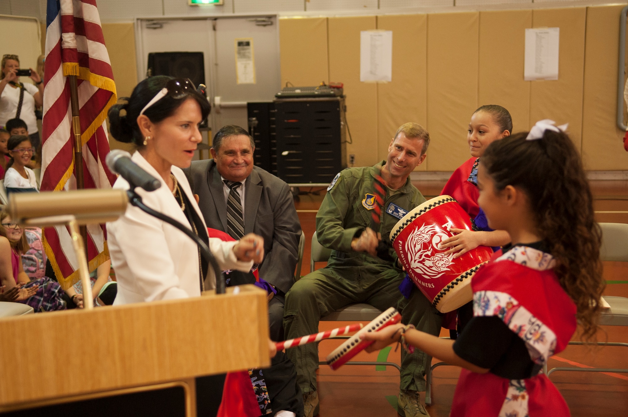 U.S. Air Force Col. David A. Mineau, 18th Operations Group commander, speaks to the children of Amelia Earhart Intermediate School during the first day back to school ceremony on Kadena Air Base, Japan, Aug. 31, 2015. Mineau and AEIS’s principal ‘drummed’ in the new school year during this years ceremony. (U.S. Air Force photo by Airman 1st Class Zackary A. Henry)