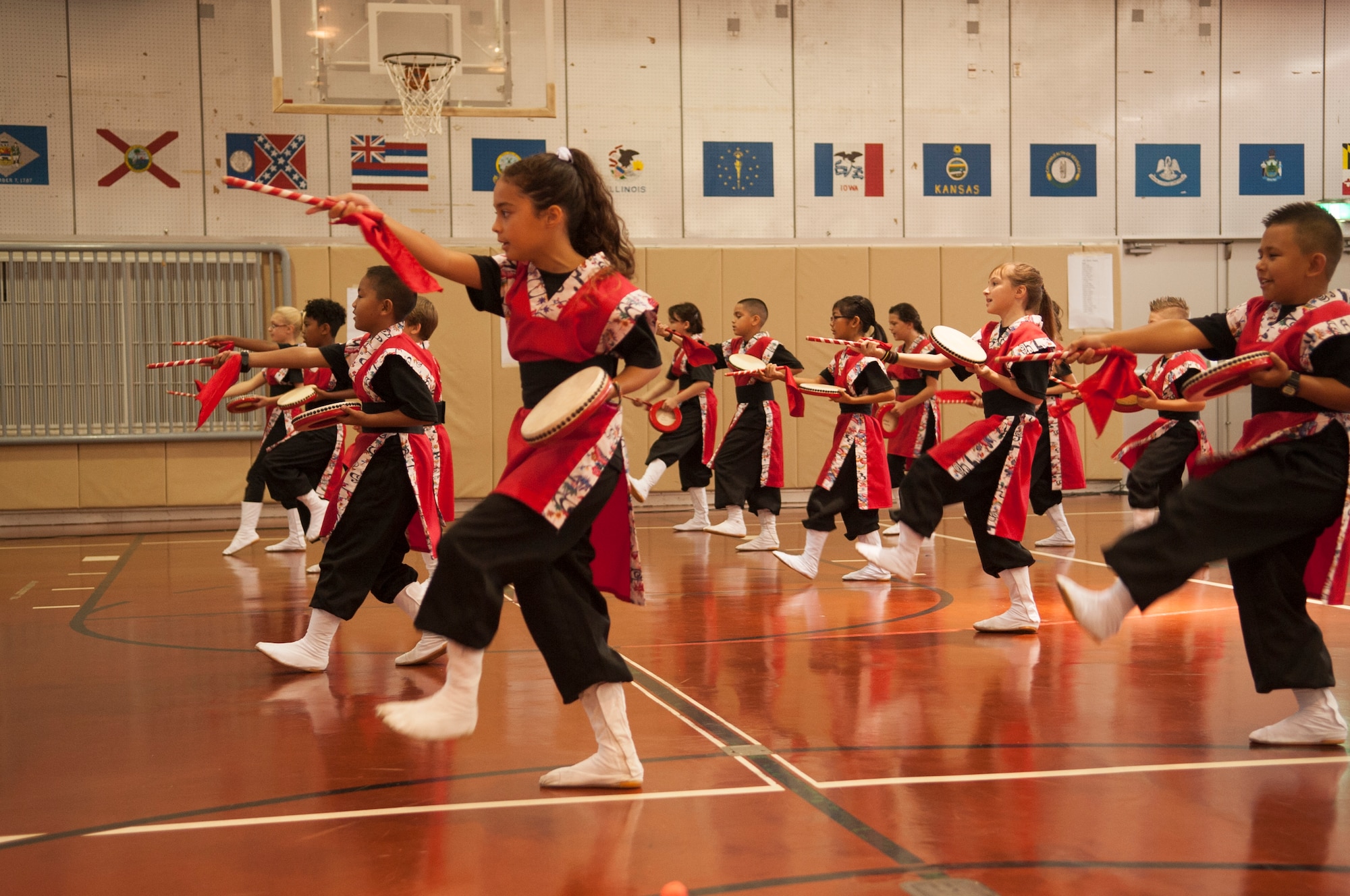 Students from Amelia Earhart Intermediate School perform Eisa dancing and Taiko drumming during the first day back to school ceremony on Kadena Air Base, Japan, Aug. 31, 2015. The Taiko drums are traditionally used in the Okinawa Eisa Festival to cheerfully send off ancestors during Obon. (U.S. Air Force photo by Airman 1st Class Zackary A. Henry)