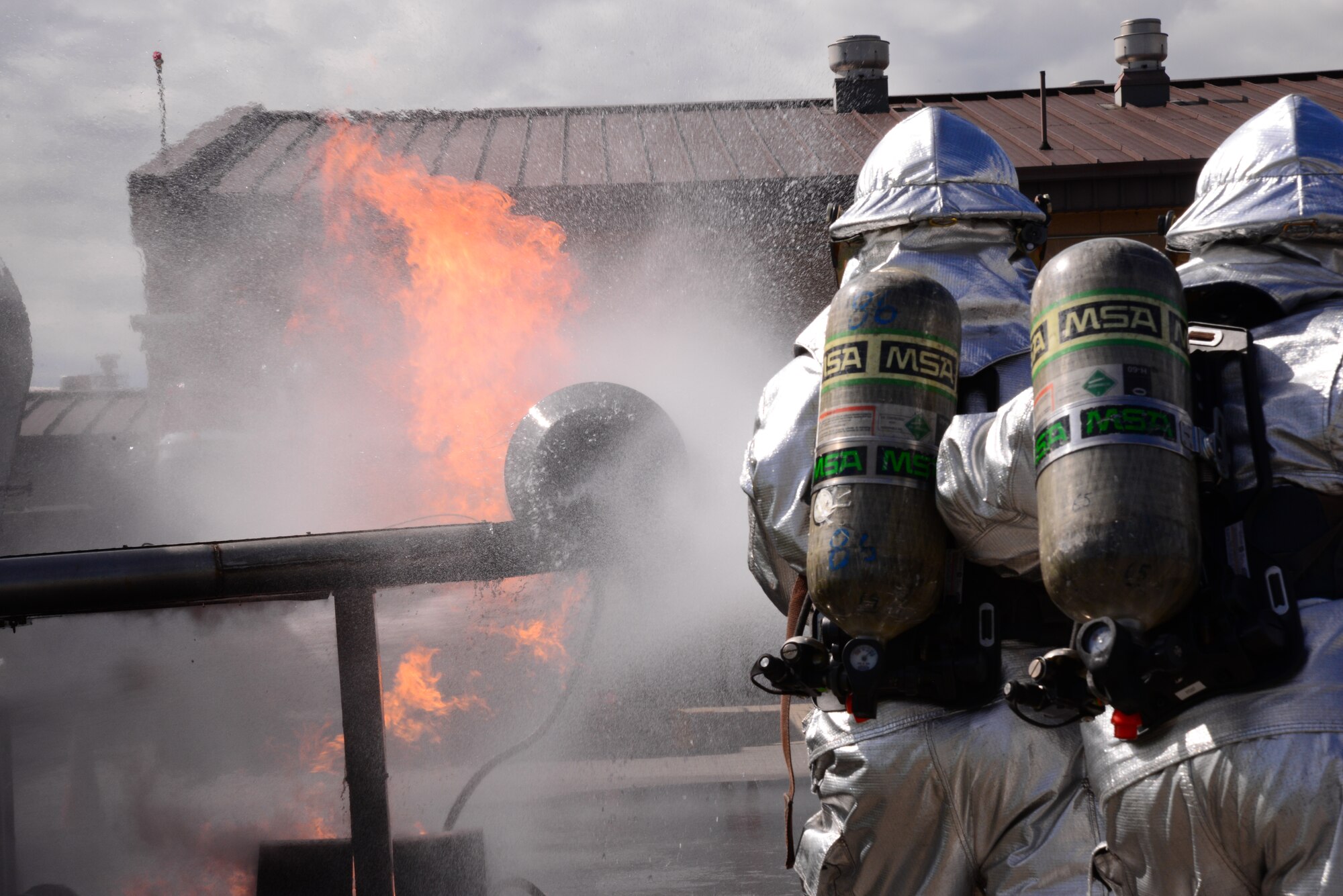 Firefighters from the Songtan fire station practice putting out an aircraft fire Aug 26, 2015, at Osan Air Base, Republic of Korea. Firefighters from the 51st Civil Engineer Squadron, Republic of Korea air force and Songtan fire stations came together to practice aircraft accident firefighting techniques. (U. S. Air Force photo by Staff Sgt. Benjamin Sutton) 