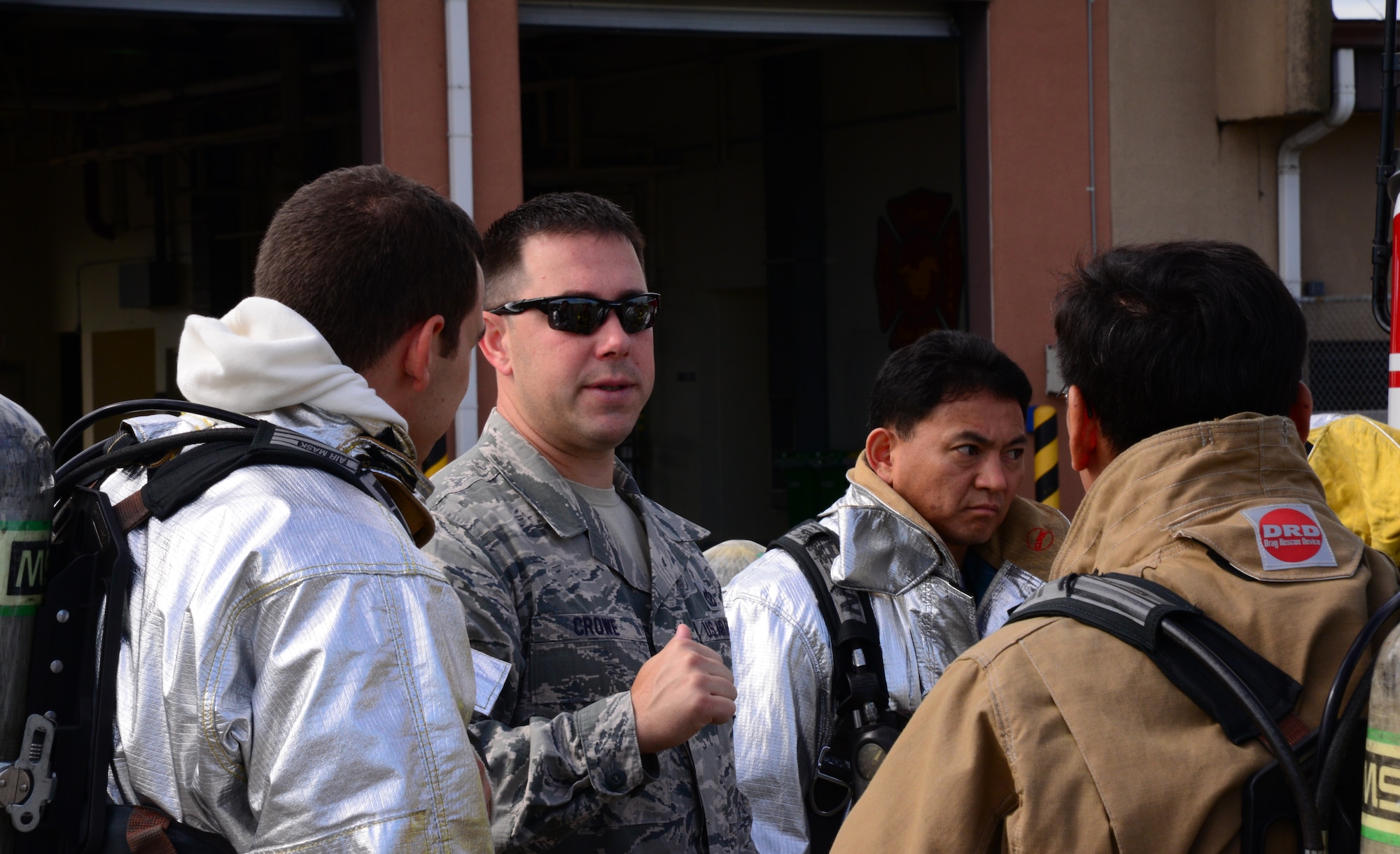 Master Sgt. Adam Crowe, 51st Civil Engineer Squadron assistant chief of fire training, discusses the scenario with members of the 51st CES prior to a training event Aug 26, 2015, at Osan Air Base, Republic of Korea. The goals of the event were to strengthen partnerships and provide a unique realistic training scenario for firefighters. (U. S. Air Force photo by Staff Sgt. Benjamin Sutton) 