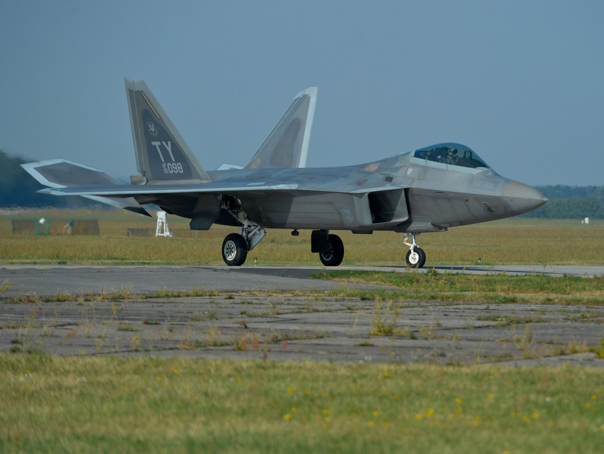 A U.S. Air Force F-22 Raptor taxis on the flightline at Lask Air Base, Poland, Aug. 31, 2015. The F-22s have previously deployed to both the Pacific and Southwest Asia for Airmen to train in a realistic environment while testing partner nations' ability to host an advanced aircraft like the F-22.  The F-22s are deployed from the 95th Fighter Squadron at Tyndall Air Force Base, Florida. The U.S. Air Force routinely deploys aircraft and Airmen to Europe for training and exercises. (U.S. Air Force photo by Staff Sgt. Joe W. McFadden)