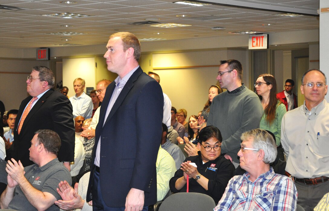 U.S. Army Corps of Engineers, New York District, employees stand to be honored by their peers and senior leadership during a recognition ceremony for the District winning a superior unit award for its efforts in Hurricane Sandy response and recovery. 