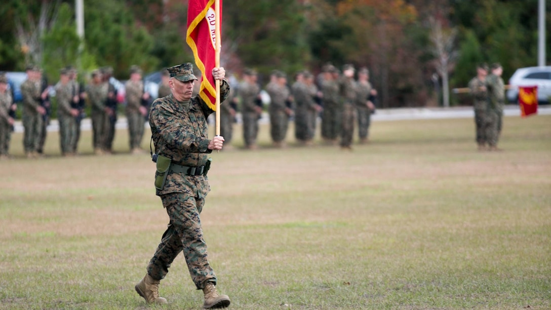 Sgt. Maj. Russell Strack, sergeant major of 8th Engineer Support Battalion, marches the unit colors during the battalion’s change of command at Camp Lejeune, N.C., Nov. 30, 2015.  Lt. Col. Lauren Edwards assumed command of the battalion from Lt. Col. David Morris. Edwards’ new responsibility, as the first female commander of an ESB, will be to provide engineer support to II Marine Expeditionary Forces.