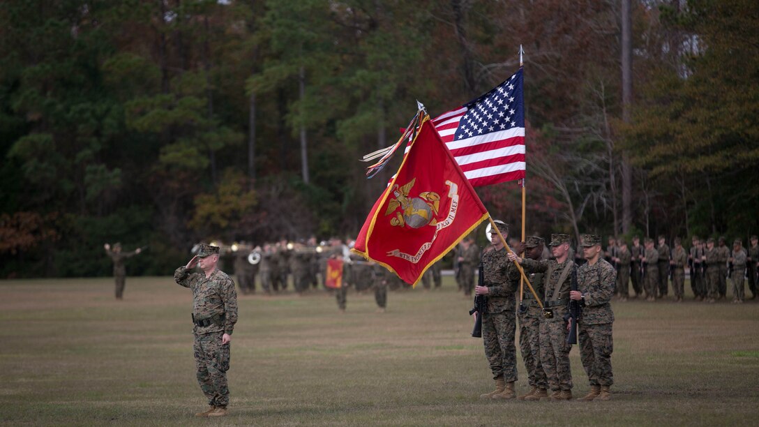 Lt. Col. David Morris salutes the colors during the 8th Engineer Support Battalion change of command ceremony at Camp Lejeune, N.C., Nov. 30, 2015. Morris passed command of the battalion to Lt. Col. Lauren Edwards. Edwards’ new responsibility, as the first female commander of an ESB, will be to provide engineer support to II Marine Expeditionary Forces. 