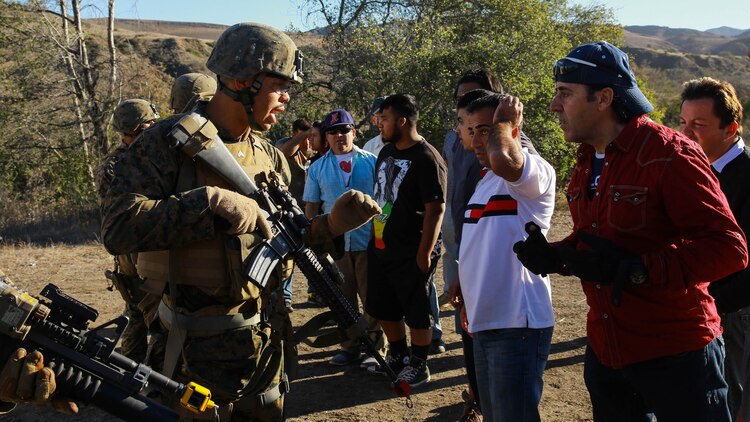 Marines with 1st Law Enforcement Battalion, I Marine Expeditionary Force Headquarters Group, I MEF attempt to de-escalate a hostile exchange with role-players during mobile immersion training aboard Marine Corps Base Camp Pendleton, Calif., Nov. 20, 2015. Mobile immersion training is a scenario-based training exercise in which the Marines engage in locating, apprehending and transporting a high-value individual.