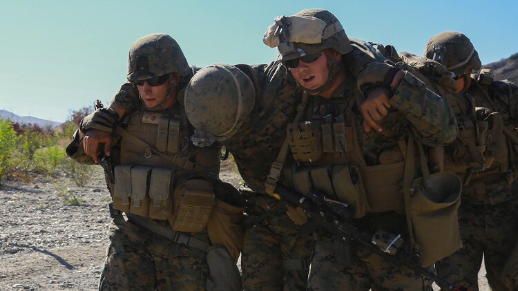 Marines with 1st Law Enforcement Battalion, I Marine Expeditionary Force Headquarters Group, I MEF evacuate a simulated casualty during mobile immersion training aboard Marine Corps Base Camp Pendleton, Calif., Nov. 20, 2015. Mobile immersion training is a scenario-based training exercise in which the Marines engage in locating, apprehending and transporting a high-value individual.