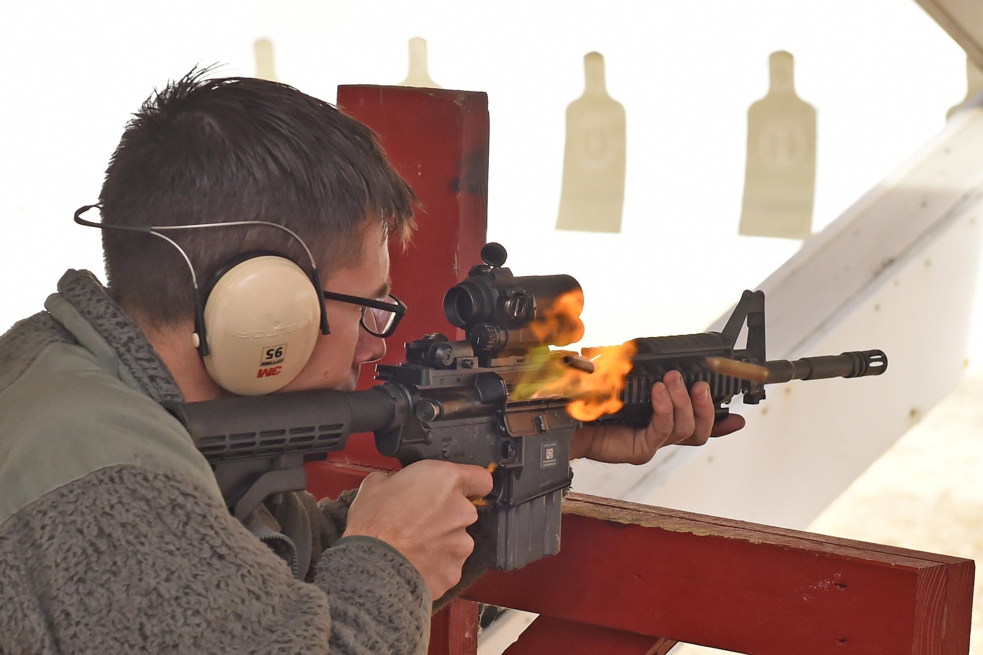 Senior Airman Beau Berkshire, a member of the 910th Civil Engineer Squadron, fires his M4 rifle during a qualification course here Nov. 7, 2015.  Airmen are required to pass regular qualification courses on the M4 rifle. (U.S. Air Force photo/Tech. Sgt. James Brock)