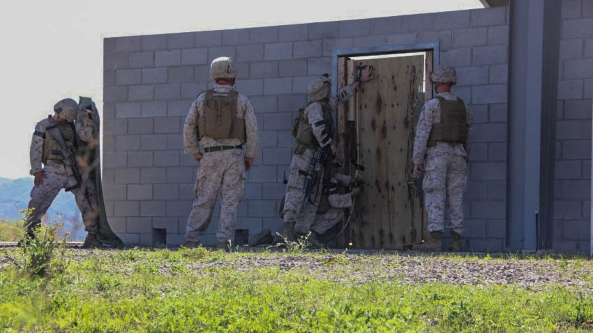 Lance Cpl. Taylor Drake, a combat engineer with 1st Combat Engineer Battalion, 1st Marine Division, is the lead on placing the charges as well as the second Marine to enter the building to clear rooms at Marine Corps Base Camp Pendleton, California, Oct.8, 2015. Drake, a Phoenix native, conducted breaching and room clearing drills with 2nd Platoon, Bravo Company, 1st CEB Marines.