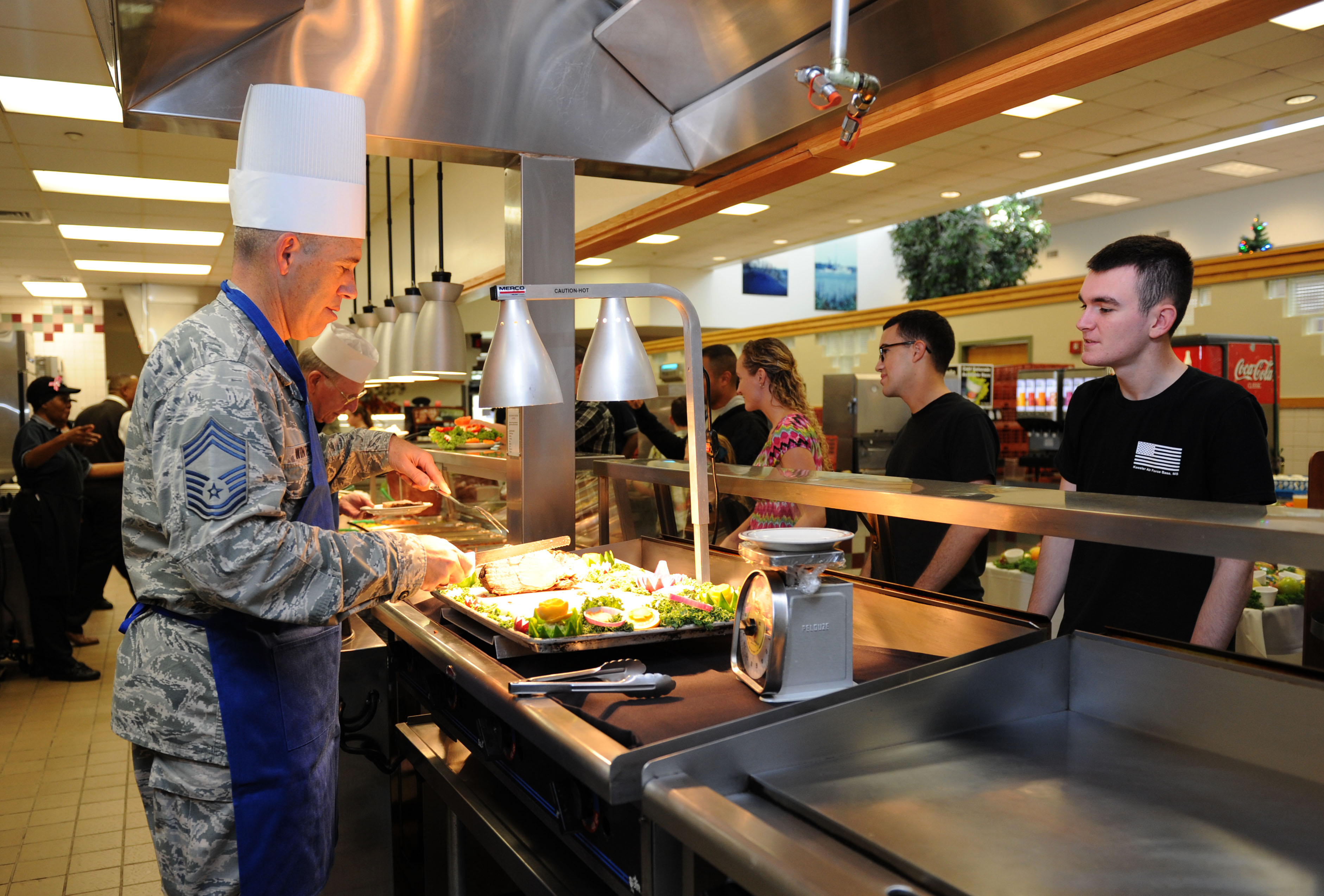 Keesler Leadership serve Airmen holiday meal