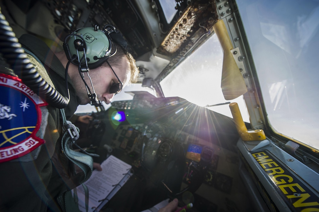 Air Force 1st Lt. Steven Strickland, 93rd Air Refueling Squadron co-pilot, sits in the co-pilot seat during an air refueling mission over Oregon, Nov. 16, 2015. It was Strickland’s first mission after arriving on Fairchild Air Force Base, Wash., -- his first assignment as a KC-135 Stratotanker pilot. U.S. Air Force Photo by Airman 1st Class Sean Campbell