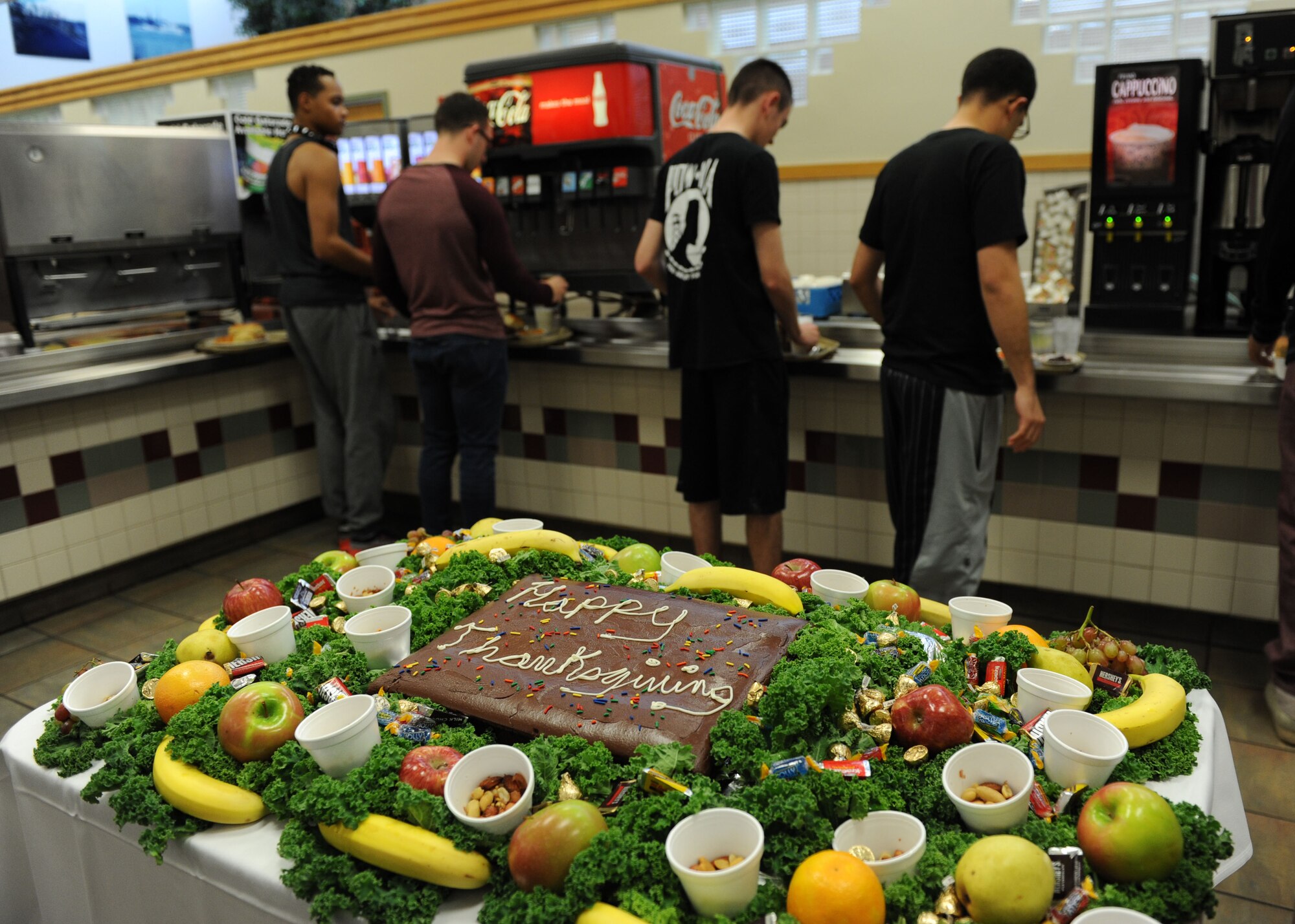 Airmen make their way through the food line at the Azalea Dining Facility on Thanksgiving Day, Nov. 26, 2015, Keesler Air Force Base, Miss. Keesler leadership served meals and interacted with Airmen who did not go home for the holiday. (U.S. Air Force Photo by Kemberly Groue)