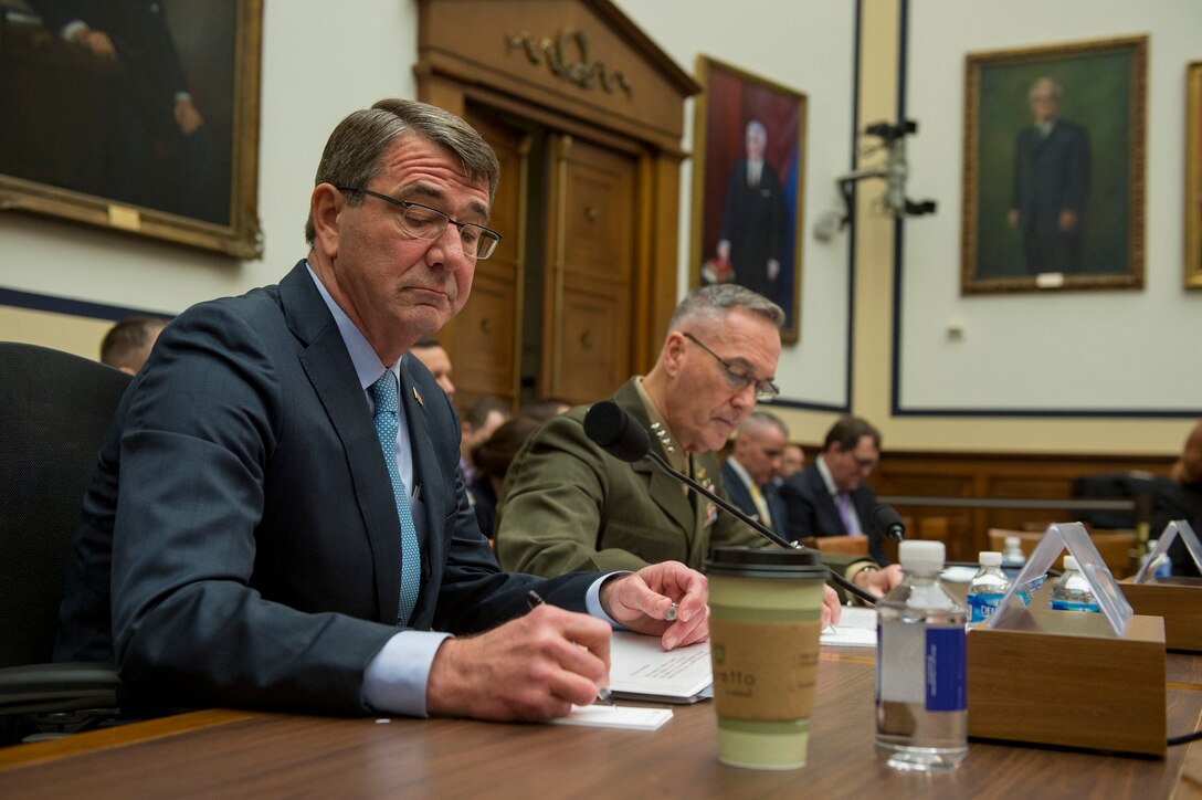 Defense Secretary Ash Carter and Marine Corps Gen. Joseph Dunford, chairman of the Joint Chiefs of Staff, take notes as they testify before the House Armed Services Committee in Washington, D.C., Dec. 1, 2015. DoD photo by Air Force Senior Master Sgt. Adrian Cadiz