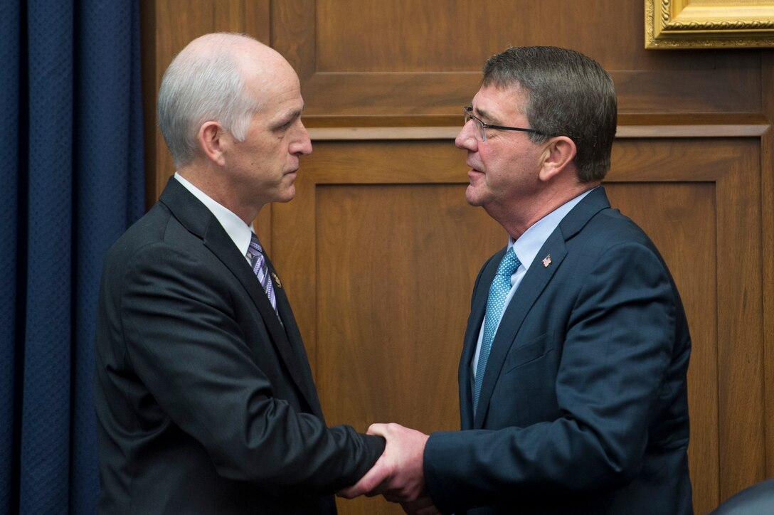 Defense Secretary Ash Carter exchanges greetings with U.S. Rep. Adam Smith, ranking member of the House Armed Services Committee, before testifying at a committee hearing in Washington D.C., Dec. 1, 2015. DoD photo by Air Force Senior Master Sgt. Adrian Cadiz