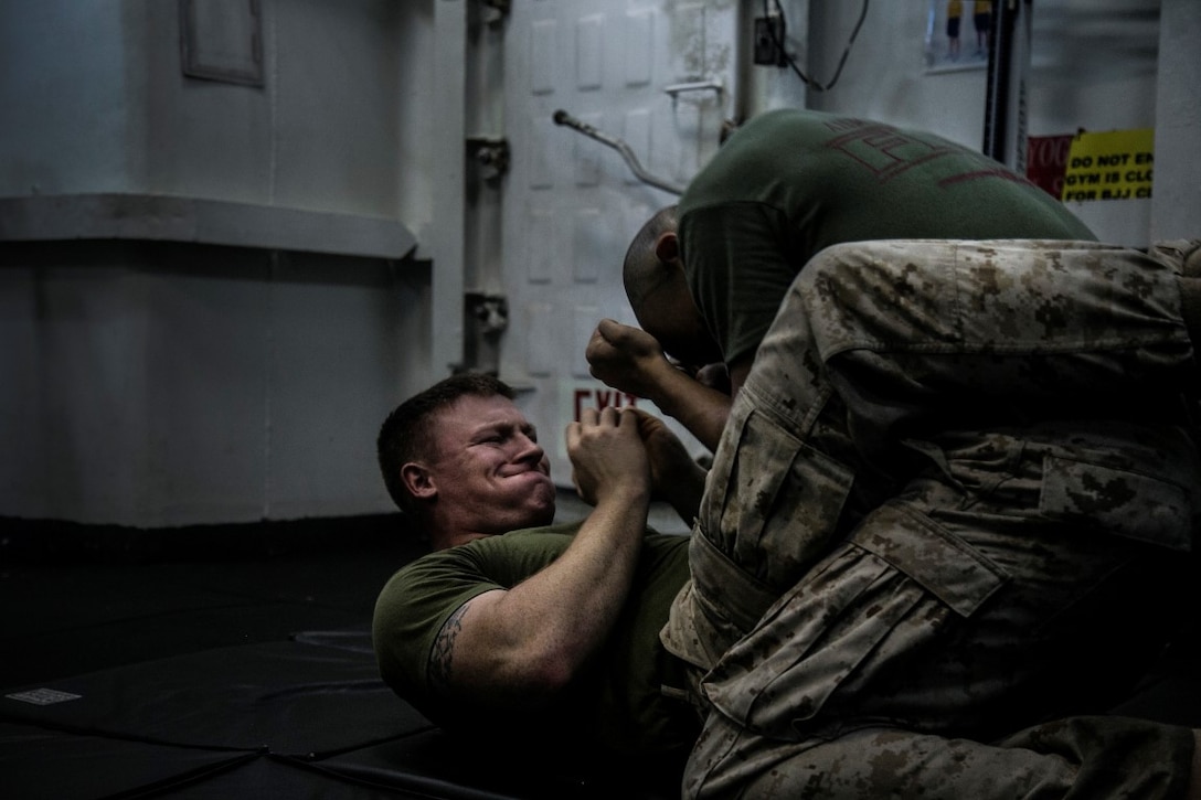 PACIFIC OCEAN (Nov. 25, 2015)  U.S. Marines with Marine Medium Tiltrotor Squadron 161 (Reinforced), 15th Marine Expeditionary Unit, practice techniques during a Marine Corps Martial Arts Program course aboard the USS Essex (LHD 2). The 15th MEU is currently deployed in the Indo-Asia-Pacific region to promote regional stability and security in the U.S. 7th Fleet area of operations. (U.S. Marine Corps photo by Cpl. Elize McKelvey/Released)