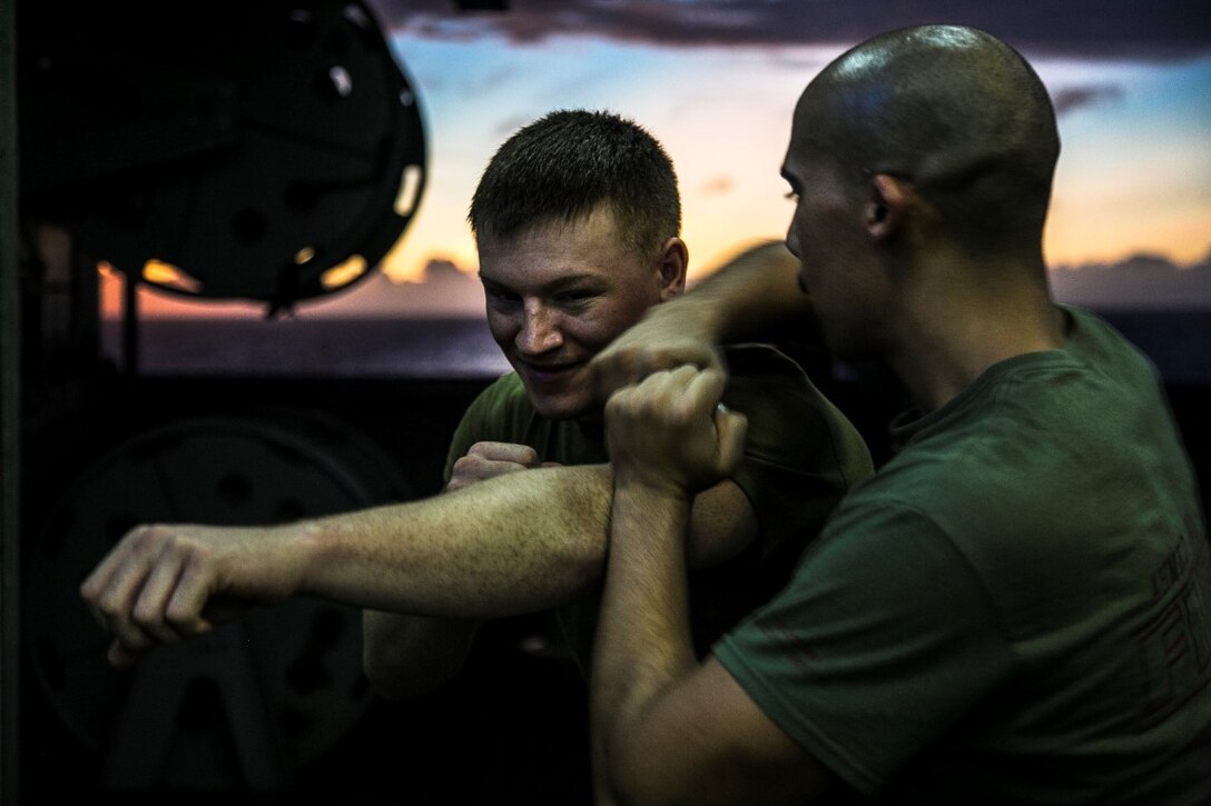 PACIFIC OCEAN (Nov. 25, 2015)  U.S. Marines with Marine Medium Tiltrotor Squadron 161 (Reinforced), 15th Marine Expeditionary Unit, throw punches during a Marine Corps Martial Arts Program course aboard the USS Essex (LHD 2). The 15th MEU is currently deployed in the Indo-Asia-Pacific region to promote regional stability and security in the U.S. 7th Fleet area of operations. (U.S. Marine Corps photo by Cpl. Elize McKelvey/Released)