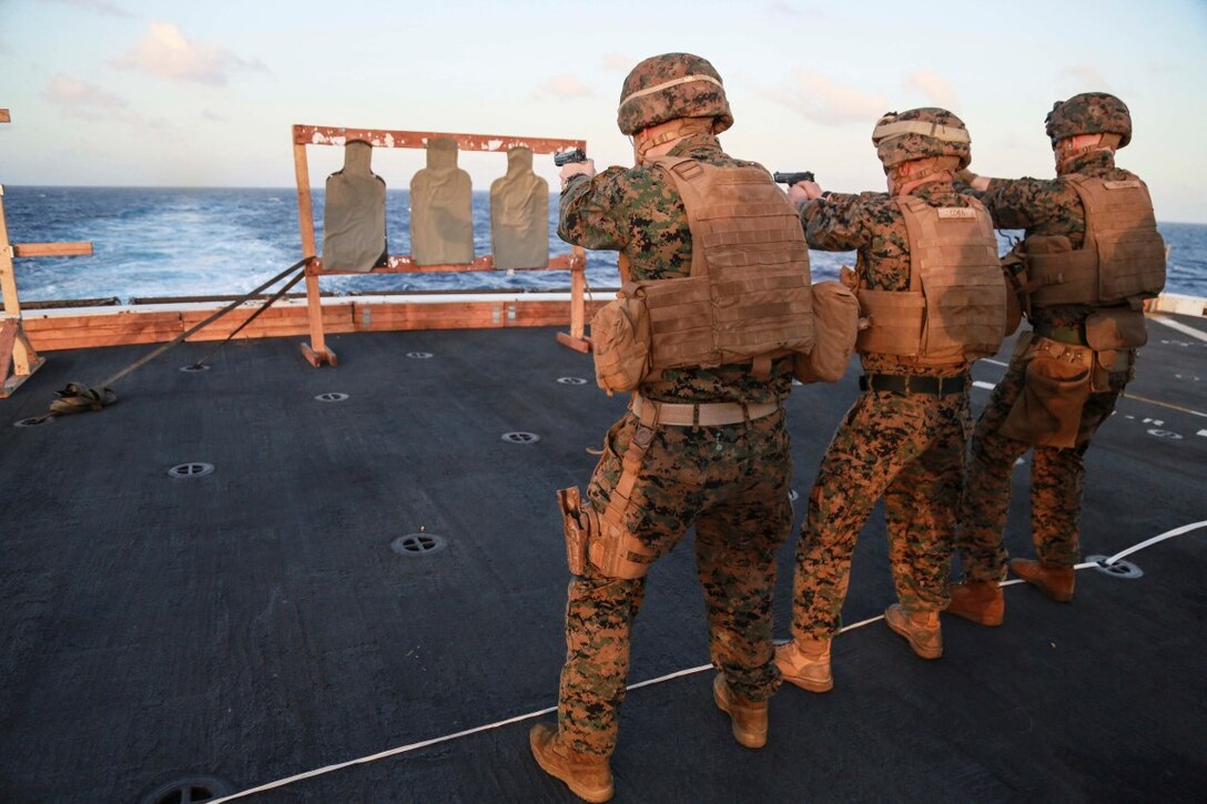 PACIFIC OCEAN (Nov. 28, 2015) U.S. Marines with 1st Light Armored Reconnaissance Detachment, Battalion Landing Team 3rd Battalion, 1st Marine Regiment, 15th Marine Expeditionary Unit, fire their weapons on the flight deck aboard the USS Anchorage (LPD 23). The 15th MEU is currently deployed in the Indo-Asia-Pacific region to promote regional stability and security in the U.S. 7th Fleet area of operations. (U.S. Marine Corps photo by Sgt. Steve H. Lopez/Released)