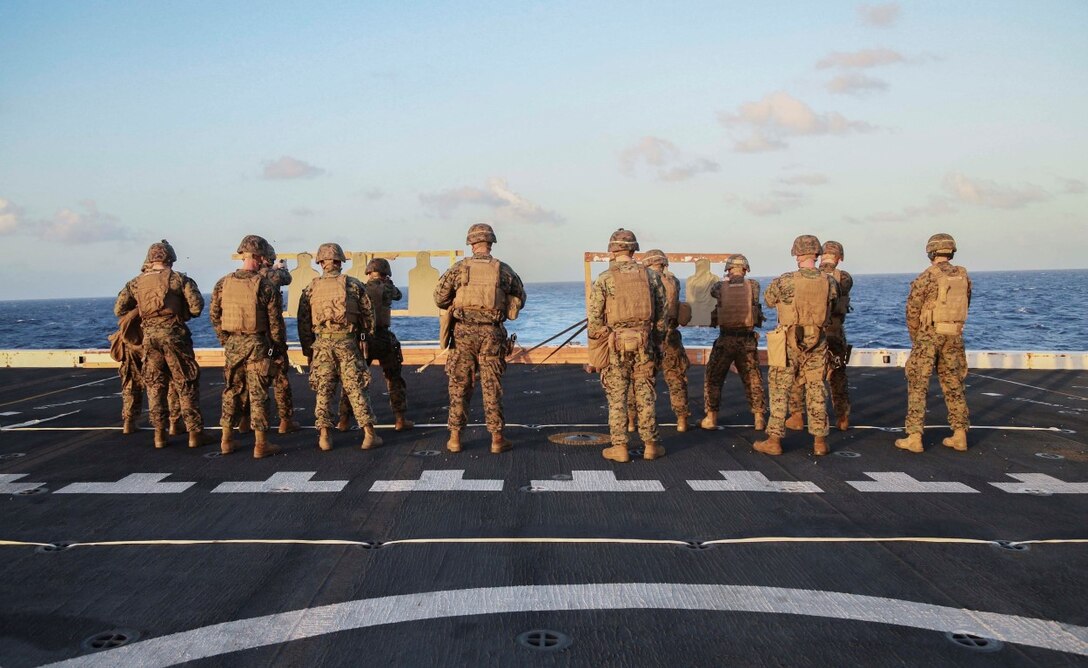 PACIFIC OCEAN (Nov. 28, 2015) U.S. Marines with 1st Light Armored Reconnaissance Detachment, Battalion Landing Team 3rd Battalion, 1st Marine Regiment, 15th Marine Expeditionary Unit, fire their weapons on the flight deck aboard the USS Anchorage (LPD 23). The 15th MEU is currently deployed in the Indo-Asia-Pacific region to promote regional stability and security in the U.S. 7th Fleet area of operations. (U.S. Marine Corps photo by Sgt. Steve H. Lopez/Released)