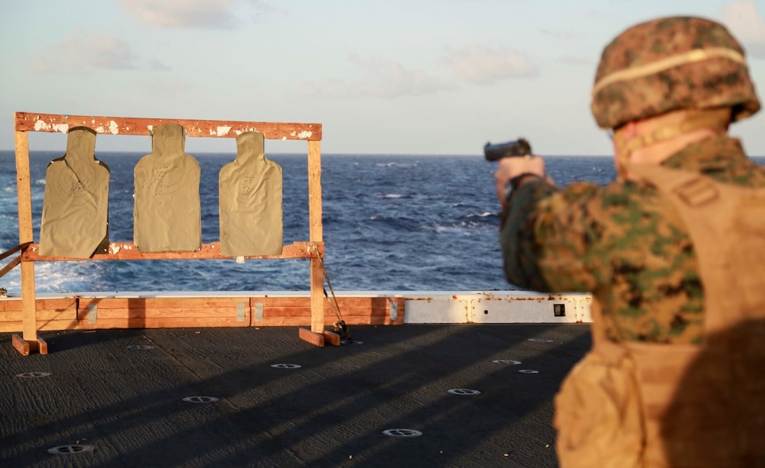 PACIFIC OCEAN (Nov. 28, 2015) A U.S. Marine with 1st Light Armored Reconnaissance Detachment, Battalion Landing Team 3rd Battalion, 1st Marine Regiment, 15th Marine Expeditionary Unit, fires his weapon on the flight deck aboard the USS Anchorage (LPD 23). The 15th MEU is currently deployed in the Indo-Asia-Pacific region to promote regional stability and security in the U.S. 7th Fleet area of operations. (U.S. Marine Corps photo by Sgt. Steve H. Lopez/Released)