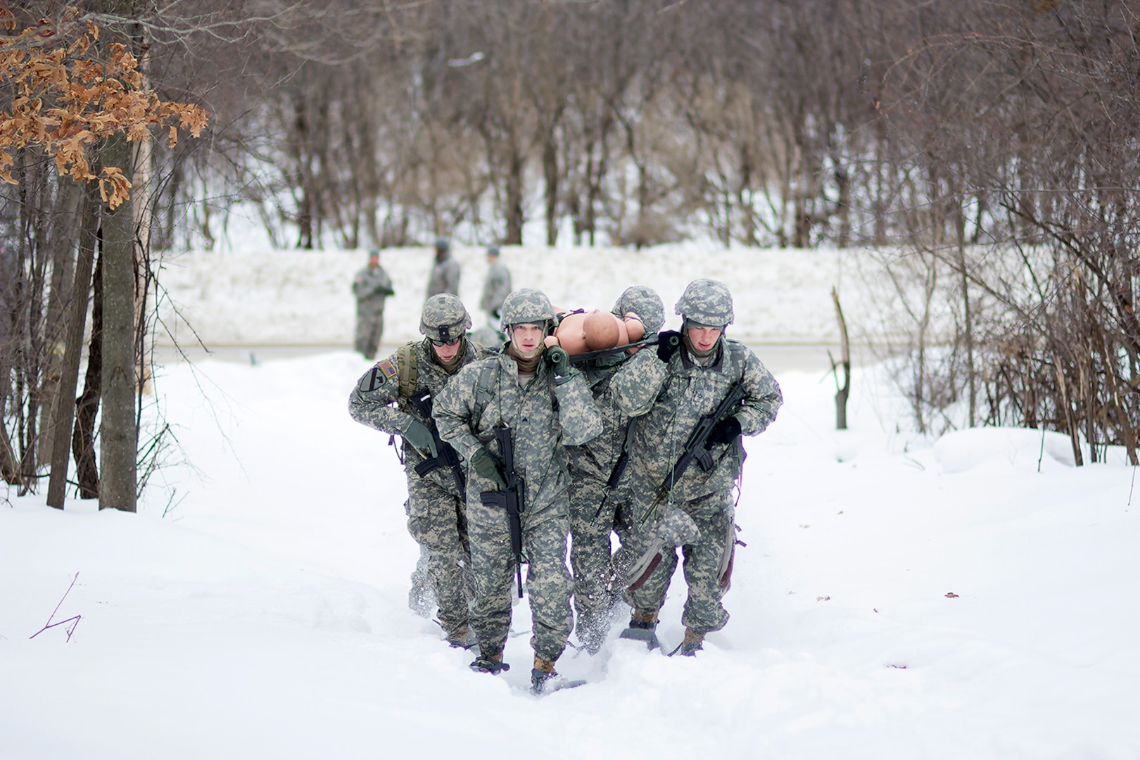 Intelligence and Sustainment Company’s team races through the snow transporting a casualty to a landing zone March 5 during the Gauntlet Challenge at Fort Drum.
