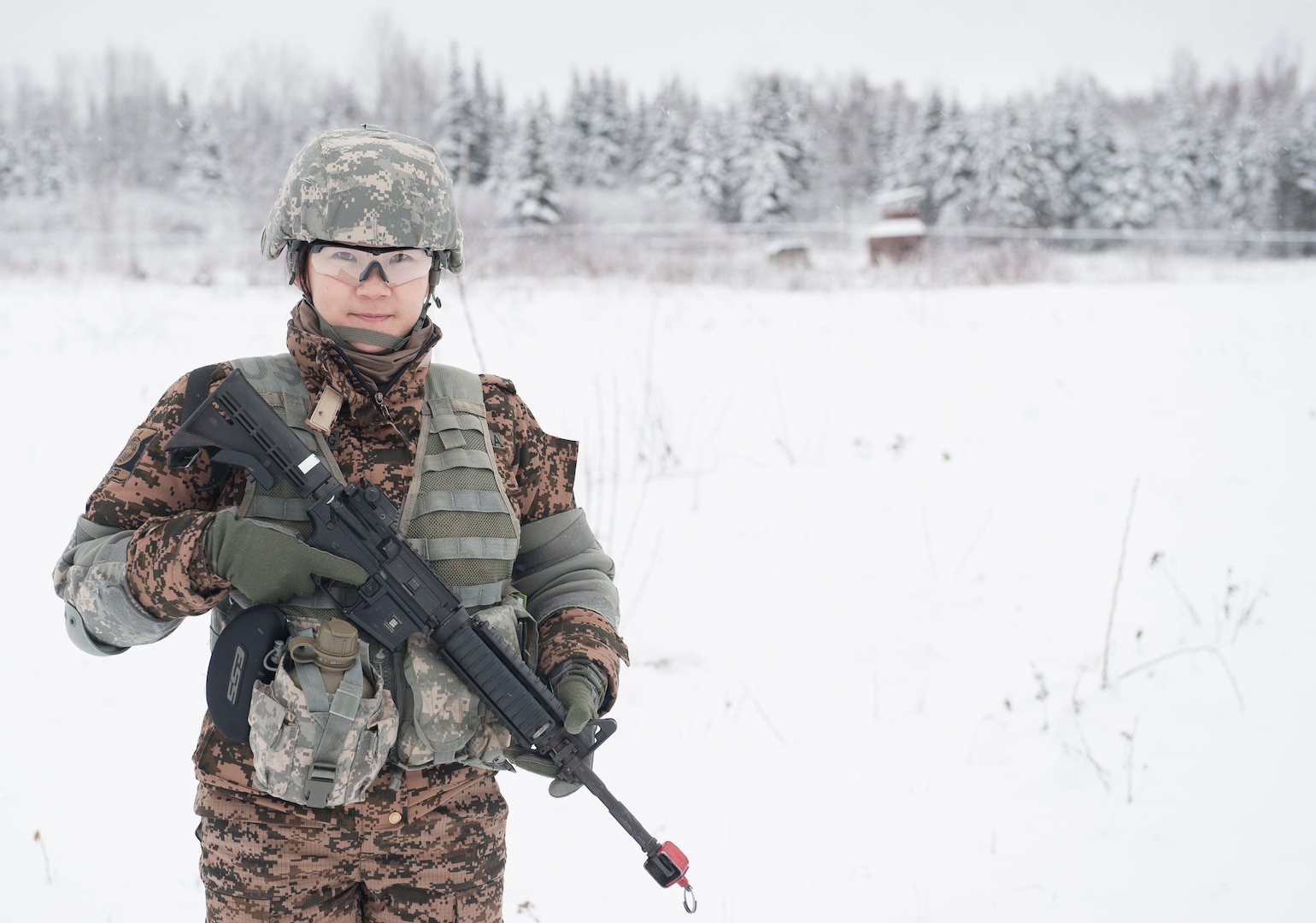 Mongolian Army Sgt. Mungunchimeg Nyamaajav stands ready to participate in the Warrior Leadership Course’s Situational Training Exercise at Joint Base Elmendorf-Richardson, Alaska, Nov. 3, 2015. Nyamaajav is the first female Mongolian soldier to train with U.S. Army Alaska. (U.S. Army photo/Sachel Harris)