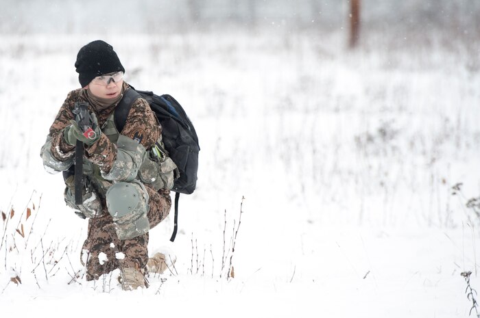 Mongolian Army Sgt. Mungunchimeg Nyamaajav holds her position during the Warrior Leadership Course’s Situational Training Exercise at Joint Base Elmendorf-Richardson, Alaska, Nov. 3, 2015. On average, the U.S. Army Alaska NCO Academy hosts 12 international students per year. (U.S. Army photo/Sachel Harris)