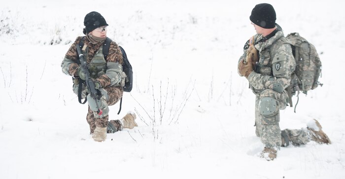 Mongolian Army Sgt. Mungunchimeg Nyamaajav works alongside a U.S. Army Alaska Soldier during the Warrior Leadership Course’s Situational Training Exercise at Joint Base Elmendorf-Richardson, Alaska, Nov. 3, 2015. 2007 was the last time Mongolian soldiers attended a course at the U.S. Army Alaska academy. (U.S. Army photo/Sachel Harris)