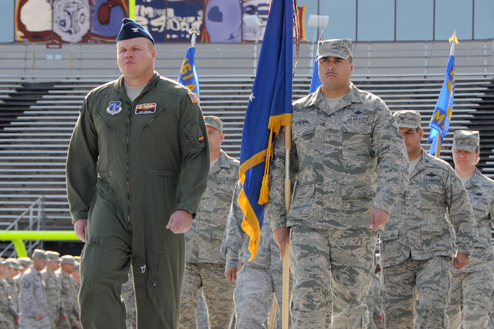 Col. Gary Brewer, 161st Air Refueling Wing commander, leads a formation during the first-ever Arizona National Guard Muster, Dec. 7, 2014, at Sun Devil Stadium in Phoenix.  Brewer, the 13th officer to lead Arizona's KC-135 Stratotanker unit, will retire from the Air Force Dec. 5 after 26 years of service. (U.S. Air National Guard photo by Tech. Sgt. Courtney Enos)