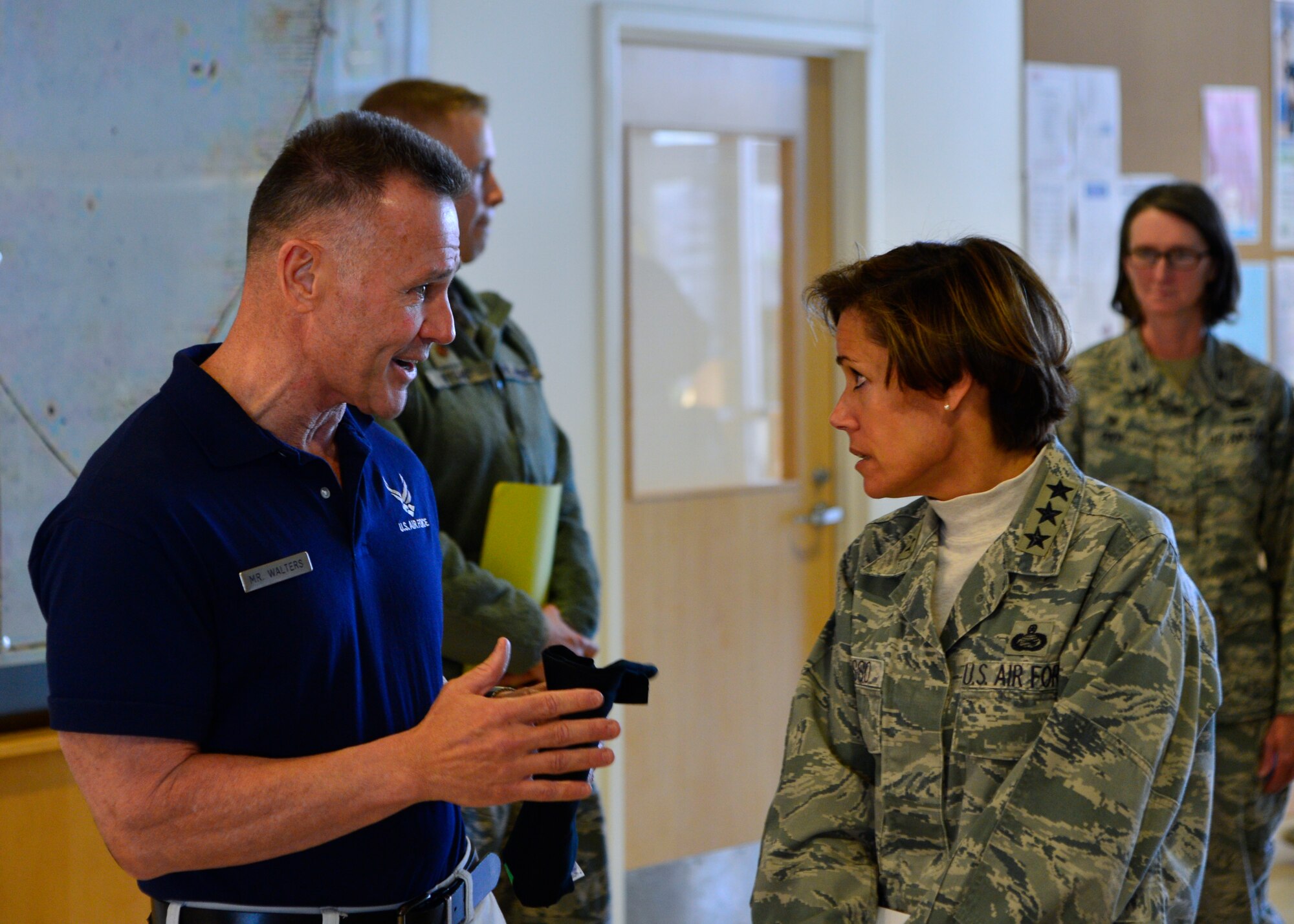 John Walters, 436th Force Support Squadron fitness program manager, briefs Lt. Gen. Gina Grosso, Air Force deputy chief of staff for manpower, personnel and services, about his fitness programs as she tours the Fitness Center Nov. 23, 2015, at Dover Air Force Base, Del. Walters created and instructs the “90+” and “48-Mintues of Hell” fitness programs at Dover AFB. (U.S. Air Force photo/Senior Airman William Johnson)