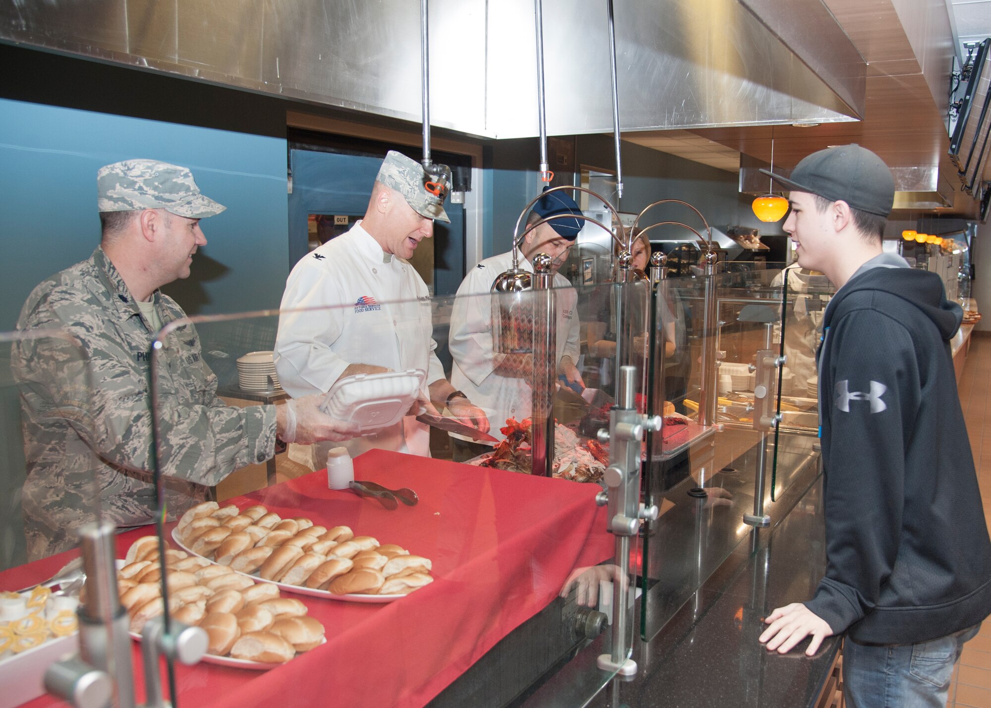 Team Dover leadership serves Airmen and their families during Thanksgiving at the Patterson Dining Facility Nov. 26, 2015, on Dover Air Force Base, Del. The dining facility recently went through a renovation allowing the dining facility to be used by civilians and retirees. (U.S. Air Force photo/Staff Sgt. Jared Duhon)