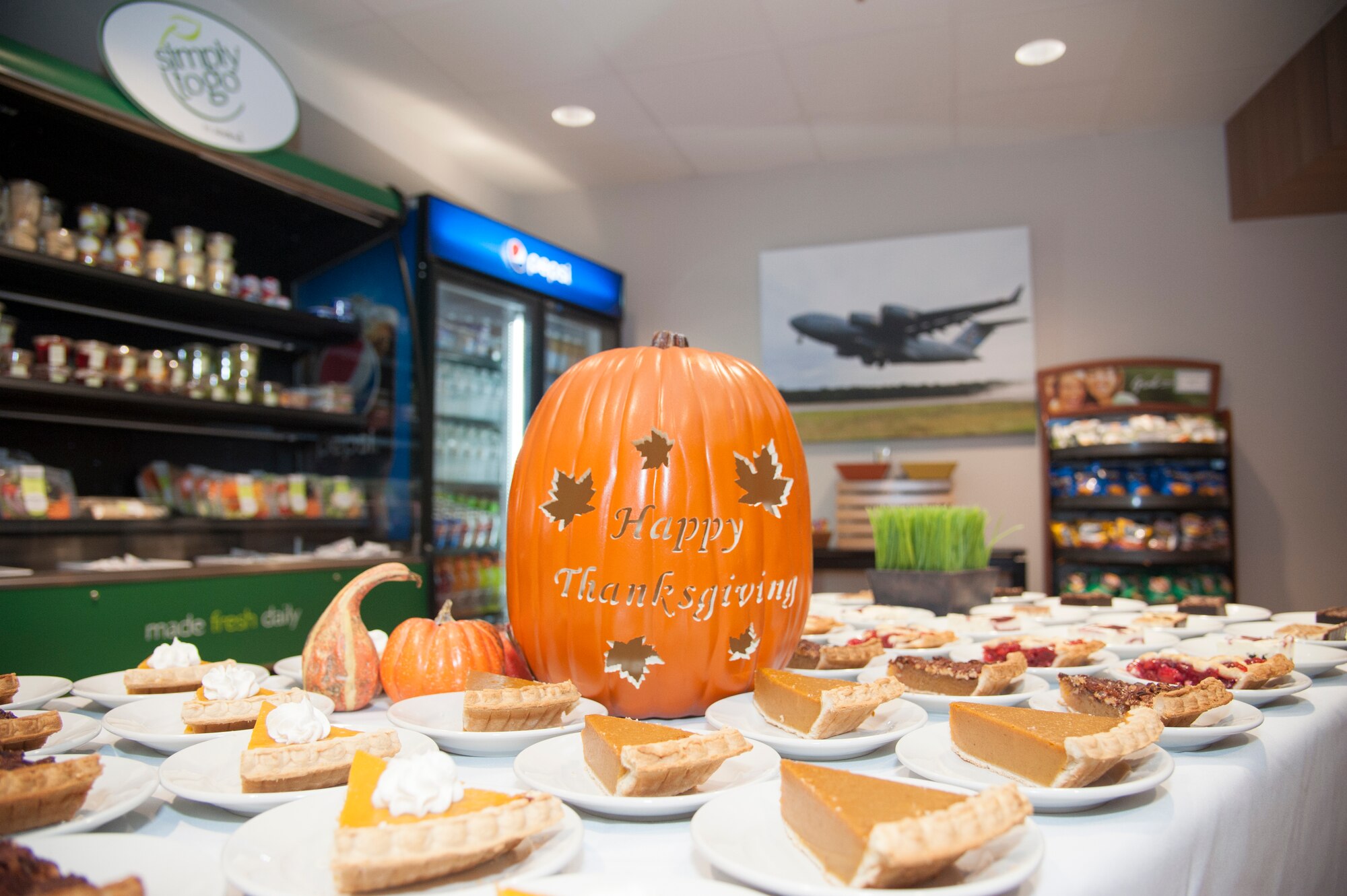 A plastic pumpkin wishes Happy Thanksgiving at the Patterson Dining Facility Nov. 26, 2015, on Dover Air Force Base, Del. Team Dover leadership served Airmen lunch on Thanksgiving Day. (U.S. Air Force photo/Staff Sgt. Jared Duhon) 