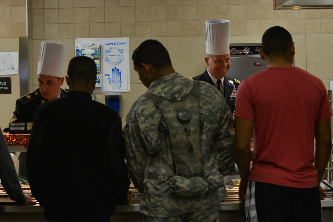 U.S. Army Gen. David G. Perkins, the commander of the U.S. Army Training and Doctrine Command (TRADOC), right, and Command Sgt. Maj. David S. Davenport, the command sergeant major of TRADOC, prepare Thanksgiving plates for Soldiers at Fort Eustis, Va., Nov. 26, 2015.  Leadership throughout Joint Base Langley-Eustis (JBLE) dedicated part of their holiday to serve JBLE members who were unable to go home for the holiday. (U.S. Air Force photo by Staff Sgt. Natasha Stannard)
