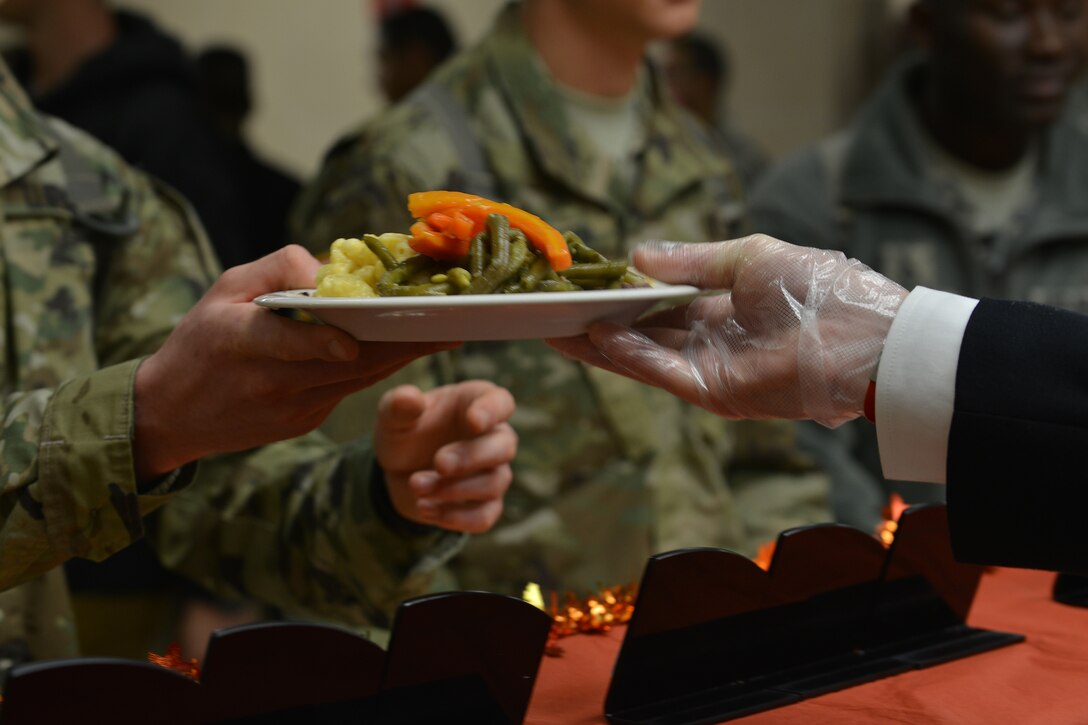 Fort Eustis leadership from across the installation serves U.S. Soldiers a traditional Thanksgiving meal at Fort Eustis, Va., Nov. 26, 2015. Joint Base Langley-Eustis hosted Thanksgiving meals at each installation ensuring Service members and their families could enjoy a traditional holiday meal. (U.S. Air Force photo by Staff Sgt. Natasha Stannard)