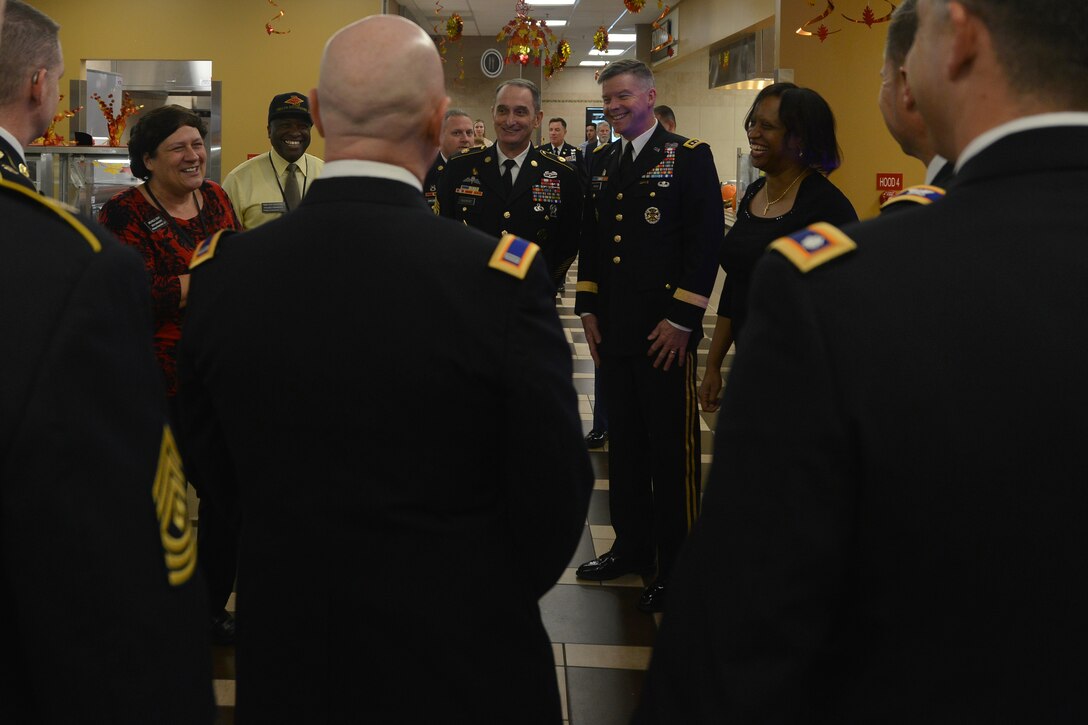 Michele Gray, manager of the Warrior Café Dining Facility, left, briefs Fort Eustis leadership before serving a Thanksgiving meal at Fort Eustis, Va., Nov. 26, 2015. As part of a continued tradition, Joint Base Langley-Eustis’ leadership serves holiday meals to U.S. Soldiers, their family members, retirees and installation personnel who are unable to visit home for the holidays. (U.S. Air Force photo by Staff Sgt. Natasha Stannard)