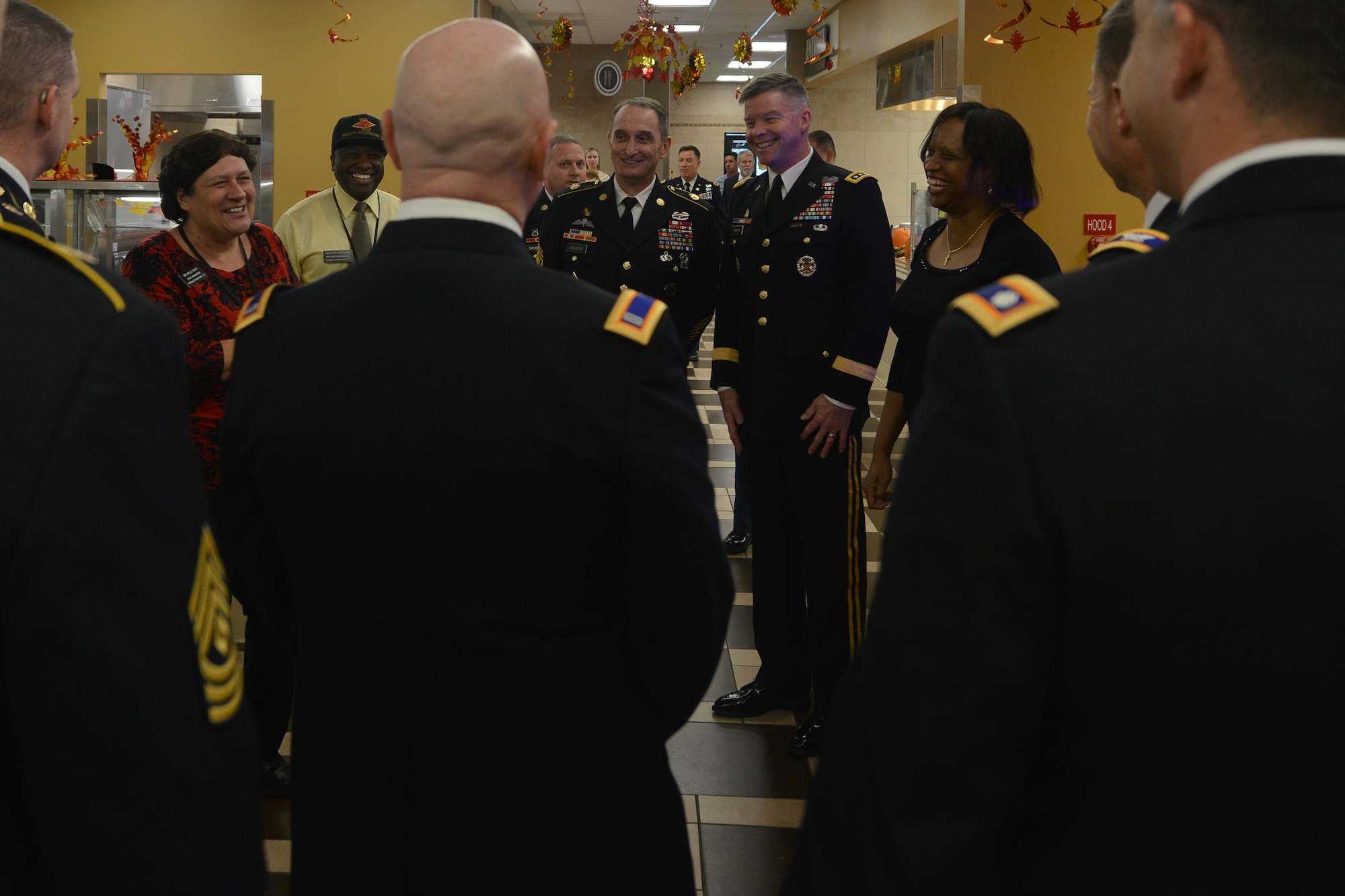 Michele Gray, manager of the Warrior Café Dining Facility, left, briefs Fort Eustis leadership before serving a Thanksgiving meal at Fort Eustis, Va., Nov. 26, 2015. As part of a continued tradition, Joint Base Langley-Eustis’ leadership serves holiday meals to U.S. Soldiers, their family members, retirees and installation personnel who are unable to visit home for the holidays. (U.S. Air Force photo by Staff Sgt. Natasha Stannard)