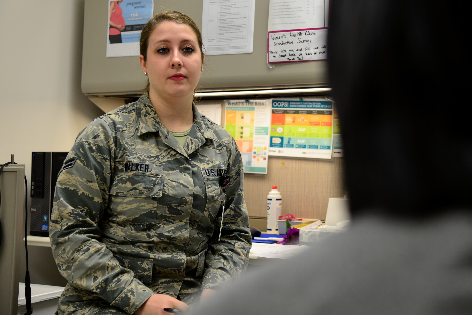 U.S. Air Force Airman 1st Class Chelsea Walker, an aerospace medical service technician assigned to the 633rd Medical Group, listens to a patient during a Women’s Health Clinic appointment at Langley Air Force Base, Va., Nov. 23, 2015. Once a female Service member, spouse or daughter is referred to the Women’s Health Clinic they may receive a variety of services including prenatal and gynecological healthcare and nutrition tips. (U.S. Air Force photo by Senior Airman Aubrey White)