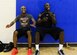 U.S. Army Staff Sgt. Marshawn Martin and Sgt. Winston Allen, Joint Base Langley-Eustis (JBLE) Raptors basketball team members, perform a wall-sit during a varsity team practice at Langley Air Force Base, Va., Sept. 22, 2015.  The team practices three days a week to prepare for the upcoming season within the Washington Area Military Athletic Conference. (U.S. Air Force photo by Airman 1st Class Derek Seifert)