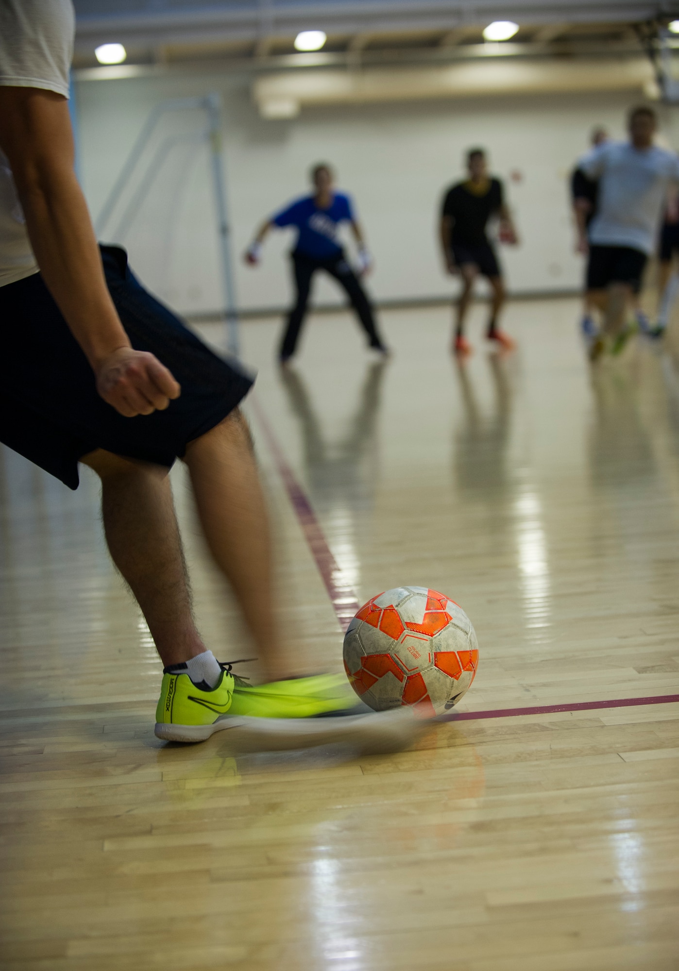 An Airman from the 5th Medical Group takes a corner kick during the intramural indoor soccer championship at Minot Air Force Base, N.D., Nov. 24, 2015. The game between the 5th MDG and 5th Contracting Squadron resulted in a win for 5th CONS. (U.S. Air Force photo/Senior Airman Apryl Hall)