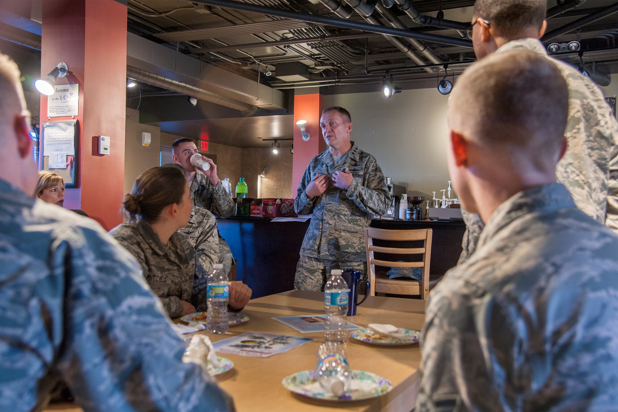 PETERSON AIR FORCE BASE, Colorado - Lt. Gen. David J. Buck, commander, 14th Air Force (Air Forces Strategic), Air Force Space Command; and commander, Joint Functional Component Command for Space, U.S. Strategic Command, speaks with Airmen at the Aragon Dining Facility during his inaugural visit to Peterson Air Force Base since taking command in August 2015. Buck visited several 21st Space Wing organizations, including Cheyenne Mountain Air Force Station, and held an all call speaking to a packed auditorium about creating a culture of mutual respect within the Air Force family, and the necessity of maintaining space superiority. (U.S. Air Force photo by Craig Denton)