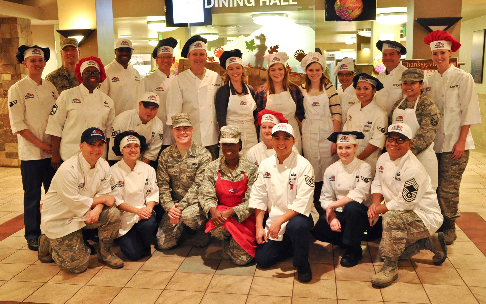 PETERSON AIR FORCE BASE, Colo. – Senior leaders from the 21st Space Wing serve Thanksgiving meals at the Aragon Dining Facility, Nov. 26, 2015, to Airmen unable to make it home for the holiday. This year’s annual event had four 25-pound turkeys, four 15-pound hams, 70 pounds of mashed potatoes with gravy and much more for members of Team Pete. (U.S. Air Force photo by Capt William Russell)