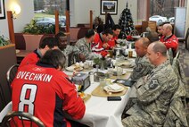 The Washington Capitals ate lunch with Airmen at the Joint Base Andrews Dining Facility during the team’s tour of the base Dec. 1, 2015. The visit included performances by the U.S. Air Force Band and the Air Force Honor Guard, aircraft tours, team-building activities, and a demonstration by the Security Forces military working dogs.