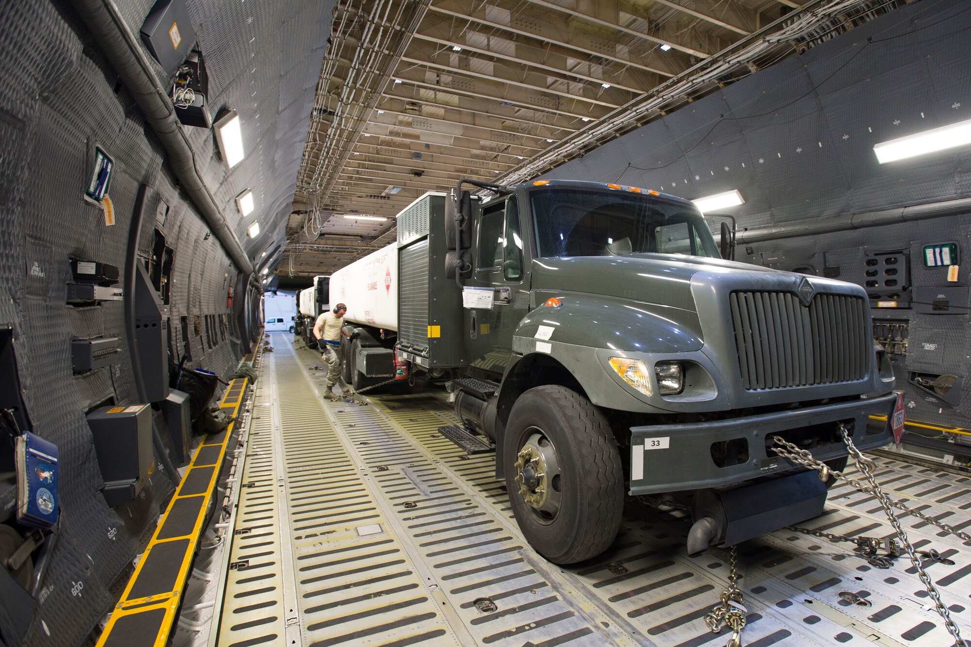 A C-5 Super Galaxy cargo plane from Travis Air Force Base, California, landed at Edwards AFB to be loaded with three fuel trucks belonging to the 412th Logistics Readiness Squadron Nov. 23. (U.S. Air Force photo by Ethan Wagner)