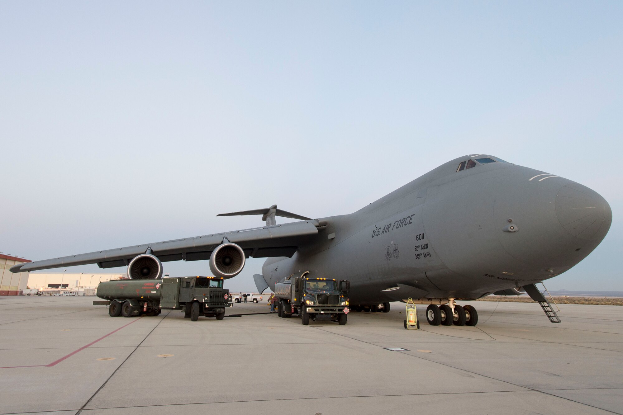 A C-5 Super Galaxy cargo plane from Travis Air Force Base, California, landed at Edwards AFB to be loaded with three fuel trucks belonging to the 412th Logistics Readiness Squadron Nov. 23. The purpose of the deployment tasking was to assist President Barack Obama's visit to Paris for the 2015 United Nations Climate Change Conference. The fuel trucks could be used to refuel to refuel the president's plane, Air Force One. (U.S. Air Force photo by Ethan Wagner)