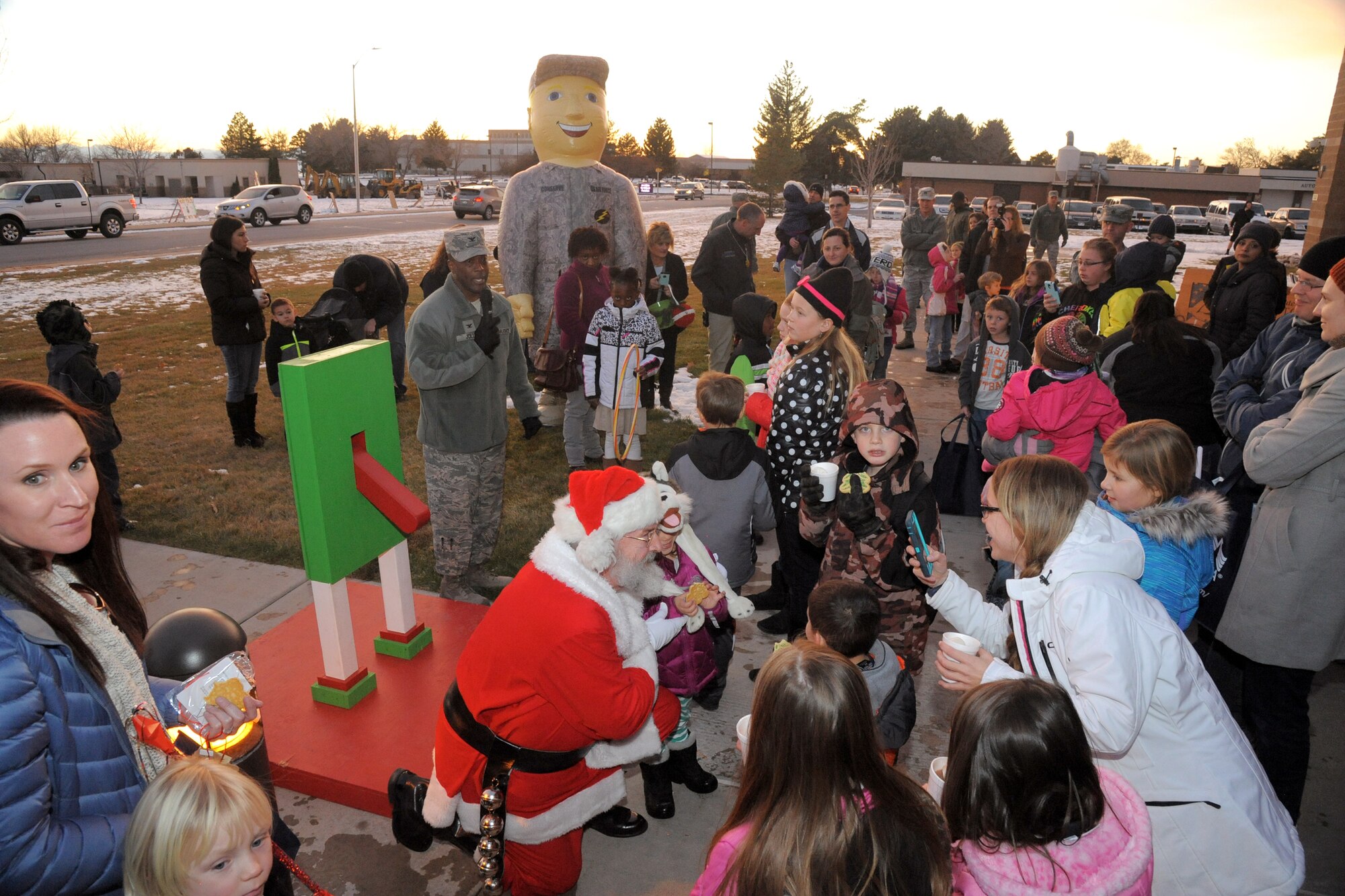 Col. Ronald Jolly, 75th Air Base Wing commander, welcomes parents and children to the Christmas tree lighting celebration Nov. 30 at Hill Air Force Base. Events included a tree lighting, visit from Santa, cookies and cocoa, crafts, and story time.