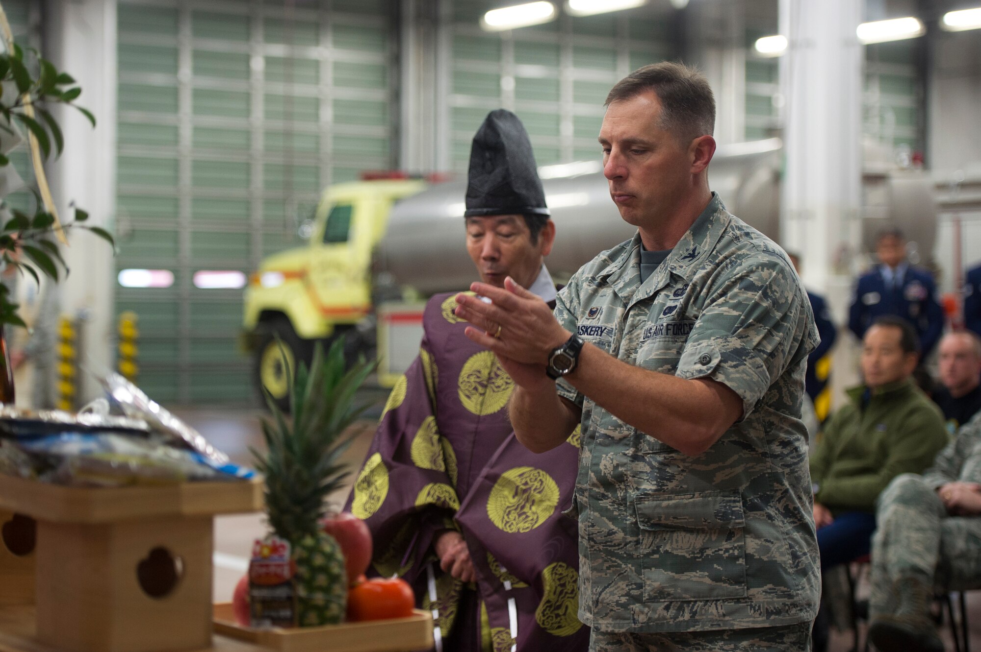 Col. Scott Maskery, 374th Mission Support Group commander, offers his prayers during a blessing of the fleet ceremony at Yokota Air Base, Japan, Nov. 25, 2015. The blessing was followed by a push-in ceremony, during which Yokota firefighters pushed the new engine into the apparatus bay by hand. (U.S. Air Force photo by Airman 1st Class Delano Scott/Released)  