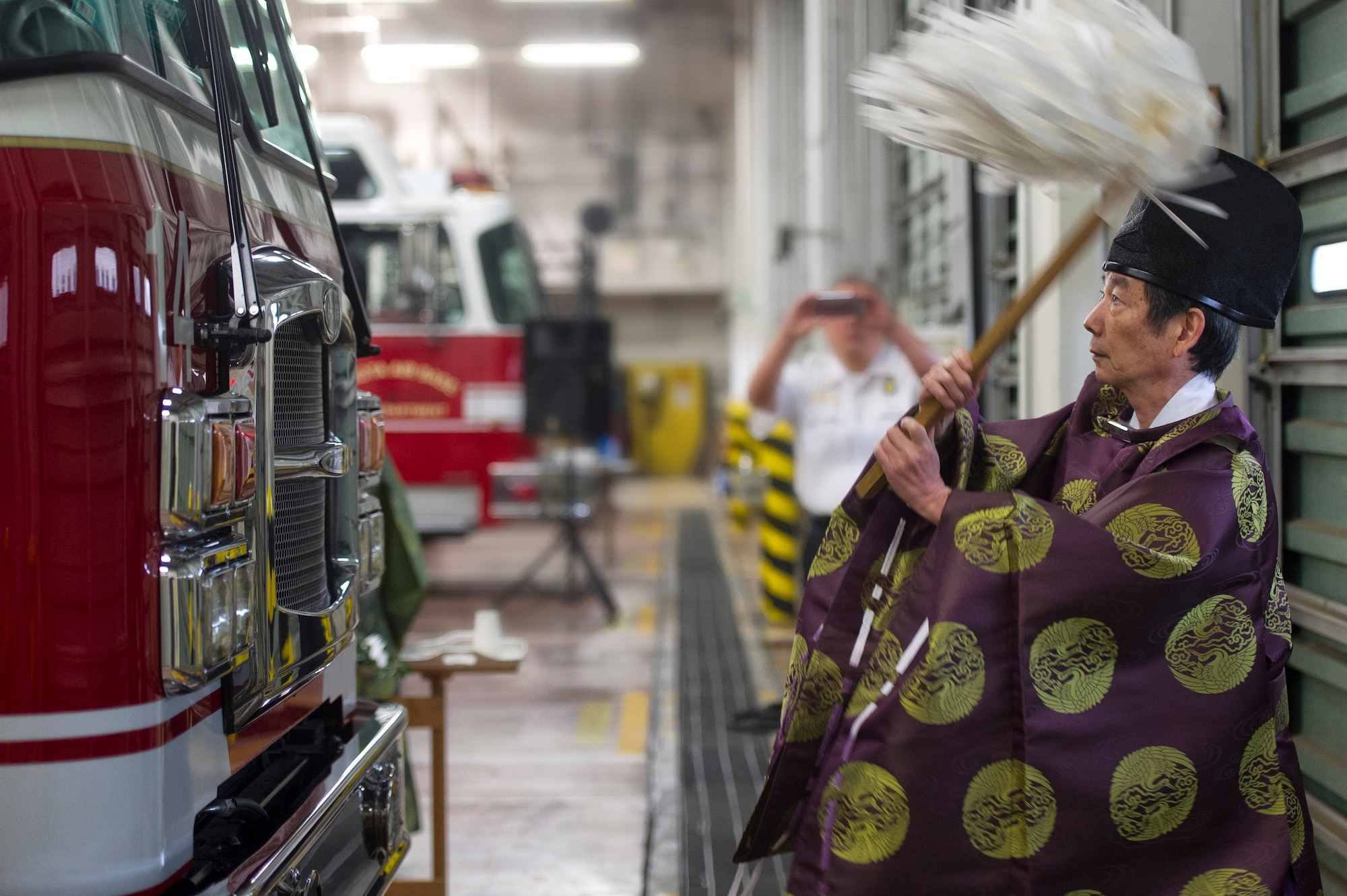 A Shinto priest performs a ritual during a blessing of the fleet ceremony at Yokota Air Base, Japan, Nov. 25, 2015. Though the blessing of the fleet ceremony is a time-honored tradition that normally features just a chaplain, this particular service was the first one to also feature Shinto priests. (U.S. Air Force photo by Airman 1st Class Delano Scott/Released)  
