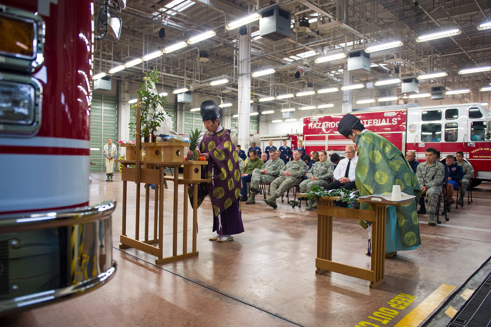 Shinto priests provide a formal reading of prayer during a blessing of the fleet ceremony at Yokota Air Base, Japan, Nov. 25, 2015. The priests, in addition to a chaplain, led the ceremony in which deities were asked to protect the firefighters and their equipment as they begin using the new vehicle. (U.S. Air Force photo by Airman 1st Class Delano Scott/Released)  